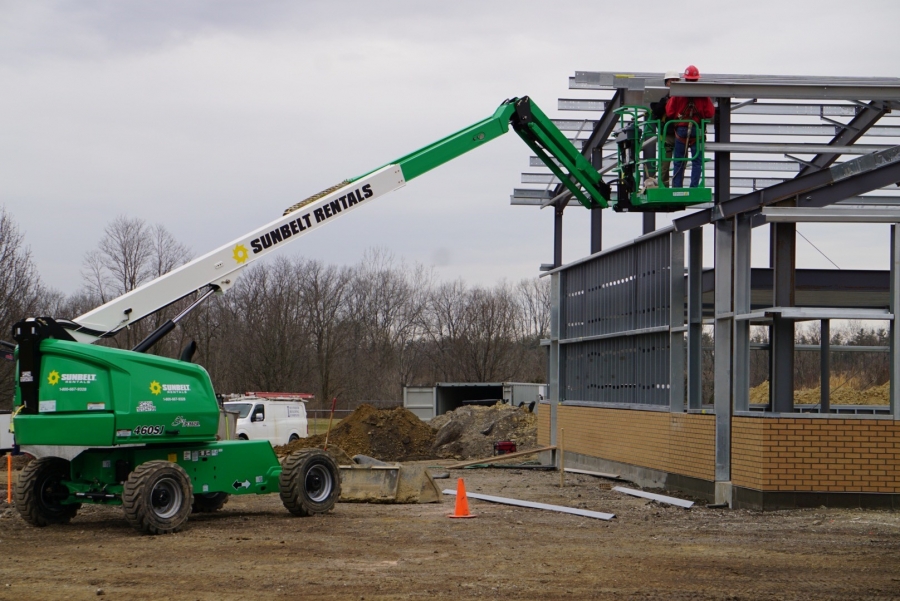 men working on the steel of a new building